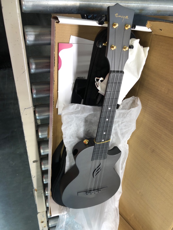 Photo 3 of Enya Concert Ukulele Nova U 23 Carbon Fiber Travel Ukulele with Beginner Kit Includes Online Lessons, Case, Strap, Capo and Strings (Black)