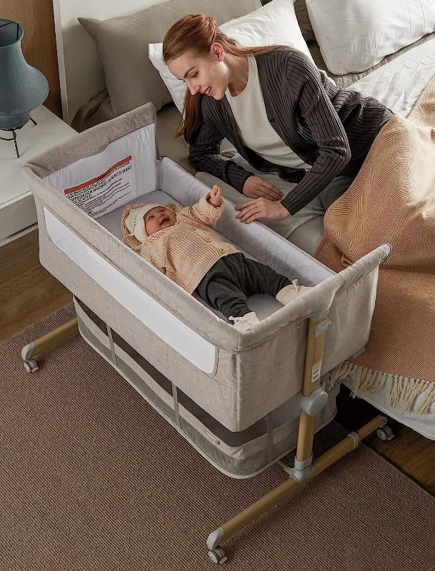 Photo 1 of Baby Bassinet Bedside Sleeper, besrey Bedside Bassinet for Newborn Infant with Comfy Mattress, 9 Height Positions, Adjustable Bedside Crib with 360° Swivel Wheels, Bassinet Sleeper with Storage Basket
