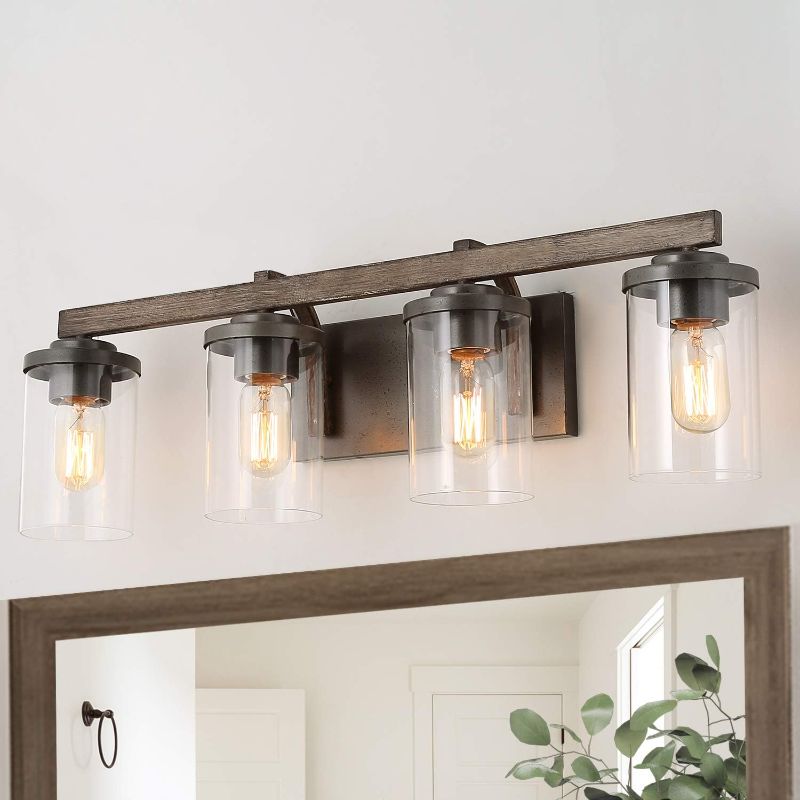 Photo 1 of \LALUZ Bathroom Vanity Light Fixtures, Farmhouse Vanity Lighting with Clear Glass Shades, Faux Wood, 4-Light, 28’’ L x 6.3’’ W x 8.7’’ H
