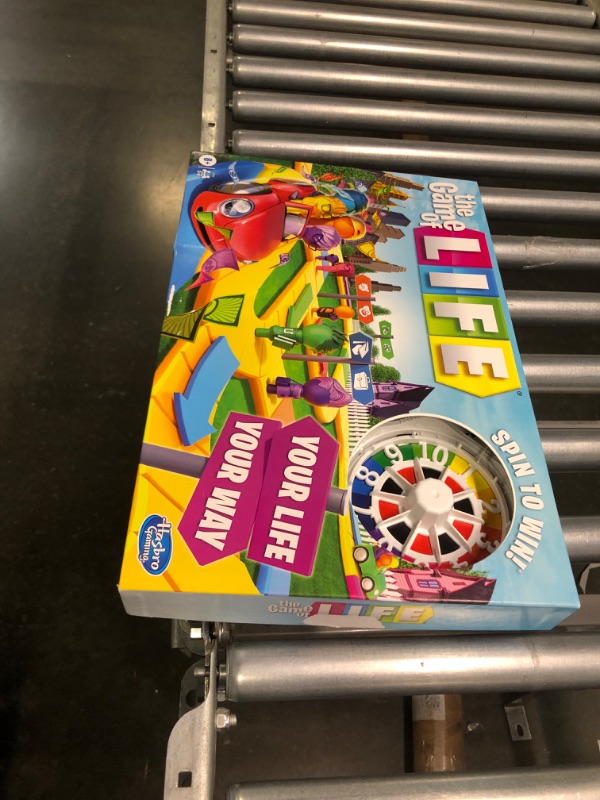 Photo 2 of Hasbro Gaming The Game of Life Game, Family Board Game for 2-4 Players, Indoor Game for Kids Ages 8 and Up, Pegs Come in 6 Colors
--- Open Box --- 