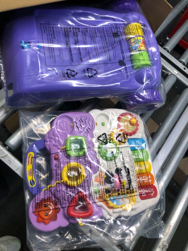Photo 1 of VTech Sit-to-Stand Learning Walker (Frustration Free Packaging), Lavender (Amazon Exclusive) & Pull and Sing Puppy Lavender Walker + Pull and Sing Puppy