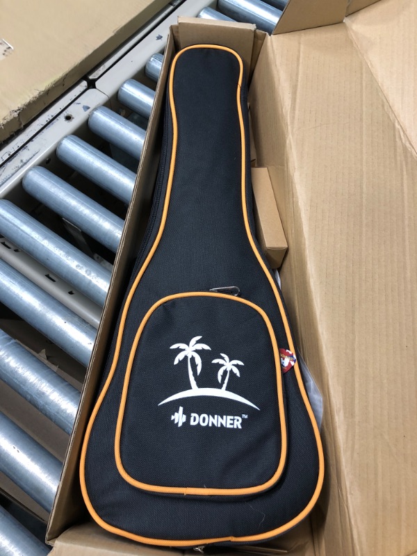 Photo 2 of Donner Concert Ukulele Mahogany 23 Inch Ukelele Starter Bundle Kit with Free Online Lesson Gig Bag Strap Nylon String Tuner Picks Cloth DUC-1 Professional Ukalalee Yukalalee Gift