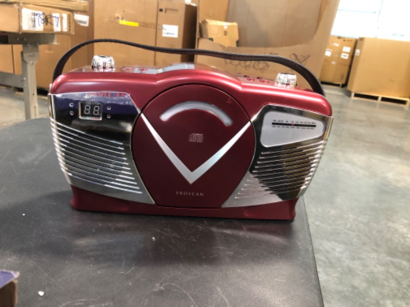 Photo 2 of PROSCAN Retro Style Portable CD Boombox with AM/FM Radio- Top Loading CD - Aux-in Jack - AC & Battery Compatible - LCD Display - Carrying Handle RED