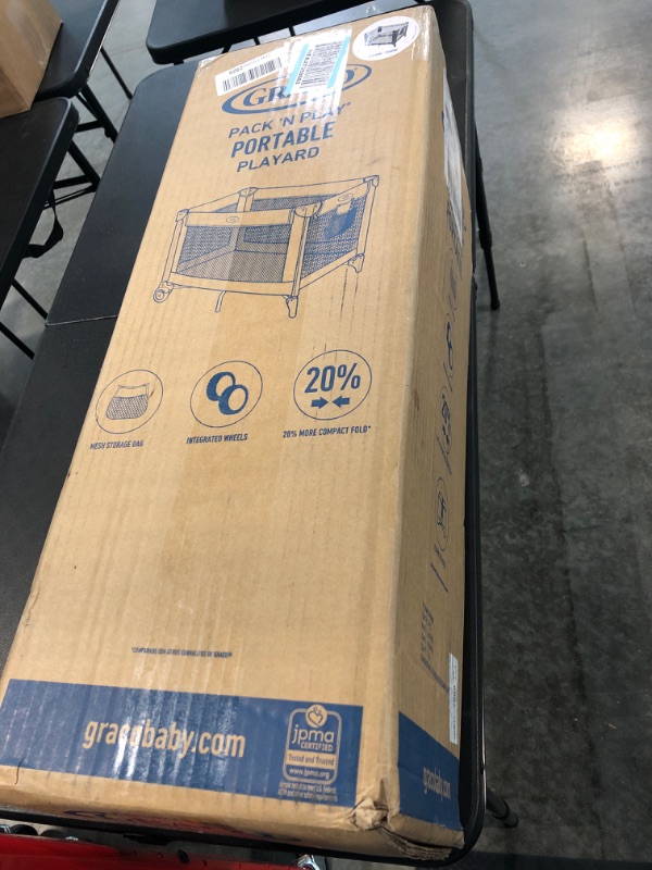 Photo 1 of Graco Pack and Play Portable Playard, Push Button Compact Fold, Carnival Portable Playard Carnival