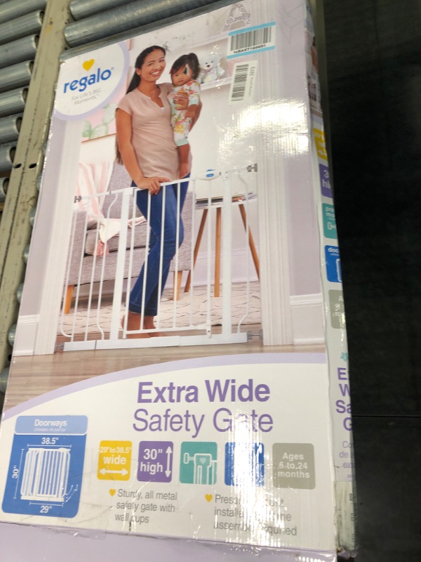 Photo 1 of Regalo Extra Wide Walk Through Baby Gate, with Included Extension Kits