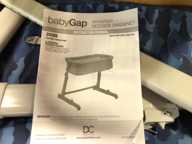 Photo 1 of babyGap by Delta Children Whisper Bedside Bassinet Sleeper with Breathable Mesh and Adjustable Heights - Lightweight Portable Crib - Made with Sustainable Materials, Navy Camo
