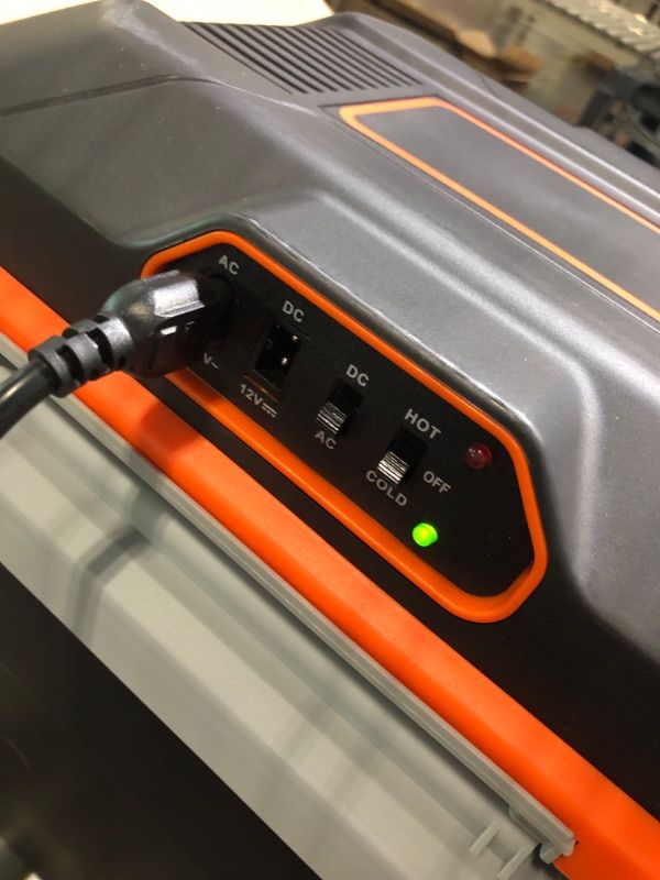 Photo 2 of ***Has a crack on the hinge*** AooDen Electric Car cooler and Warmer, 26 Quart Capacity, Thermoelectric Iceless Cooler for Travel, Camping, Vehicles, Truck, Home - 12V/24V DC and 120V AC (Black & Orange)
