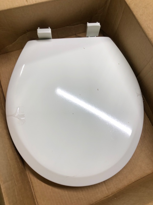 Photo 1 of  Plastic Toilet Seat with Top-Tite Hinges, Round, White