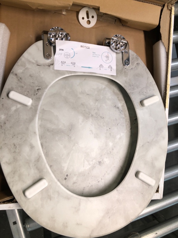 Photo 1 of Angel Shield Marble Toilet Seat Durable Molded Wood with Quiet Close,Easy Clean Quick-Release Hinges (Elongated,Gray Marble)
