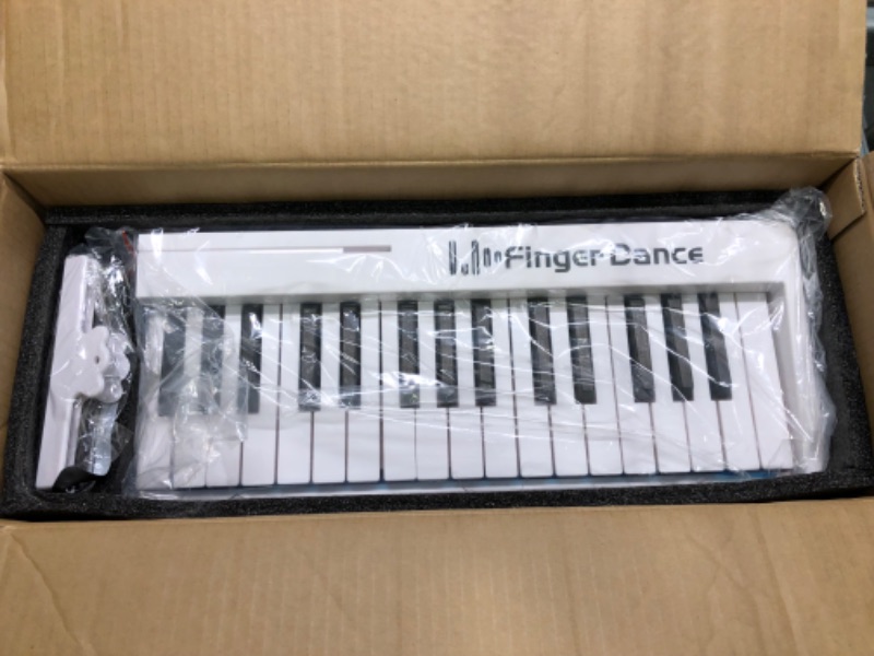 Photo 5 of Finger Dance 61 Key Folding Piano Keyboard, Upgrand Imitation Wood Texture Keyboard Portable Piano, Bluetooth & MIDI, Foldable Keyboard Piano for Beginner - Pearl White