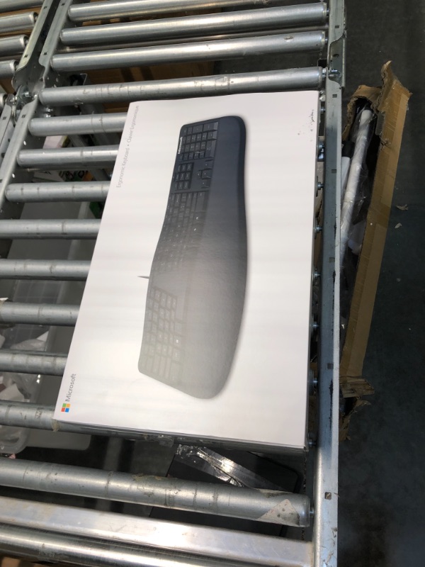 Photo 1 of Microsoft Ergonomic Keyboard - Black. Wired, Comfortable, Ergonomic Keyboard with Cushioned Wrist and Palm Support. Split Keyboard. Dedicated Office Key.