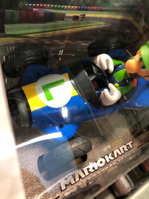 Photo 2 of Carrera RC Official Licensed Mario Kart Mach 8 Luigi 1: 18 Scale 2.4 Ghz Remote Radio Control Car with Rechargeable Lifepo4 Battery - Kids Toys Boys/Girls, (Model: 181067) Mario Kart Mach 8 - Luigi