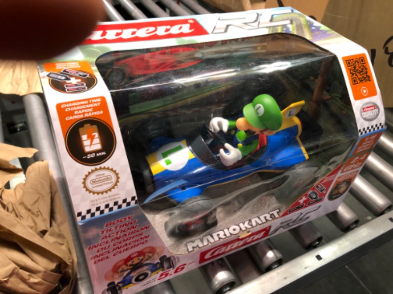 Photo 3 of Carrera RC Official Licensed Mario Kart Mach 8 Luigi 1: 18 Scale 2.4 Ghz Remote Radio Control Car with Rechargeable Lifepo4 Battery - Kids Toys Boys/Girls, (Model: 181067) Mario Kart Mach 8 - Luigi