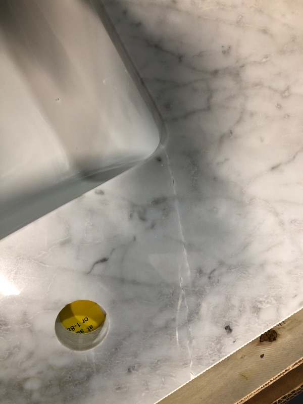 Photo 5 of **DAMAGE TO TOP**
allen + roth Natural Carrara marble 49-in White Natural Marble Undermount Single Sink 3-Hole Bathroom Vanity Top