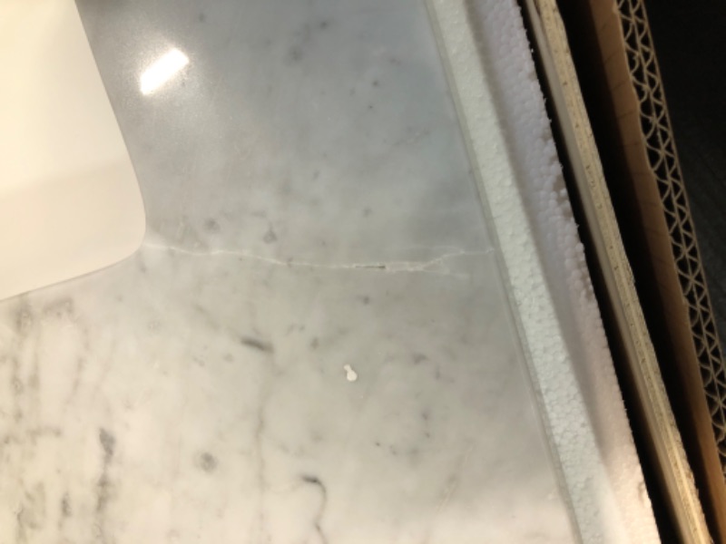 Photo 4 of **DAMAGE TO TOP**
allen + roth Natural Carrara marble 49-in White Natural Marble Undermount Single Sink 3-Hole Bathroom Vanity Top