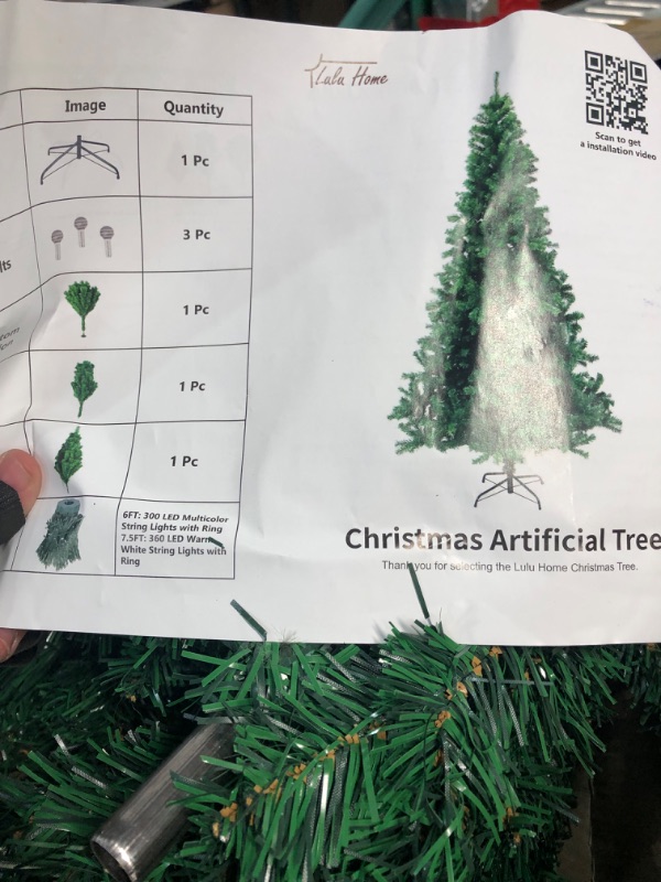 Photo 1 of ***USED***Lulu Home 6 Ft Artificial Christmas Tree with 300 LED Warm White String Lights (Not Pre-Strung) and 850 Branch Tips, 8 Lighting Modes Artificial Christmas Tree with Iron Stand