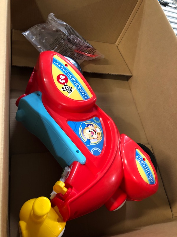 Photo 2 of Fisher-Price Laugh & Learn Smart Stages Scooter, musical ride-on toy with Smart Stages learning content for toddlers ages 1 to 3 years Standard