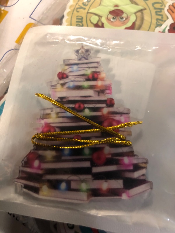 Photo 1 of 1 book tree ornament and 2 sheets of Christmas nail stickers