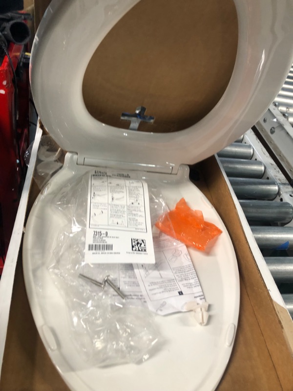 Photo 2 of * see images for damage * 
KOHLER 7315-0 Cachet Quick-Release Toilet Seat, 1, White Elongated White