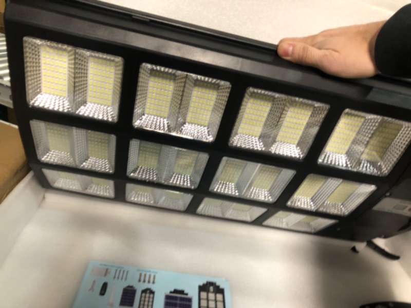Photo 1 of [FOR PARTS, READ NOTES]
wudor 2 Pack 1200W Solar Street Lights Outdoor NONREFUNDABLE