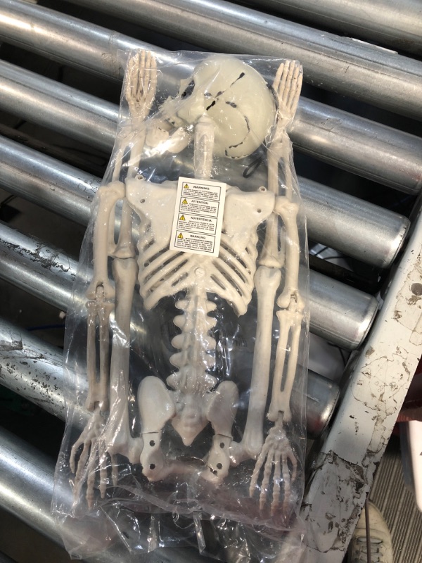 Photo 2 of JOYIN 24” Halloween Skeleton with Red LED Light Eyes Full Body Human Plastic Bones with Posable Joints Skeleton for Halloween Party 