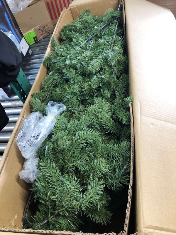 Photo 2 of ***USED***National Tree Company Pre-lit 'Feel Real' Artificial Full Downswept Christmas Tree, Green, Douglas Fir, White Lights, Includes Stand, 7 feet
