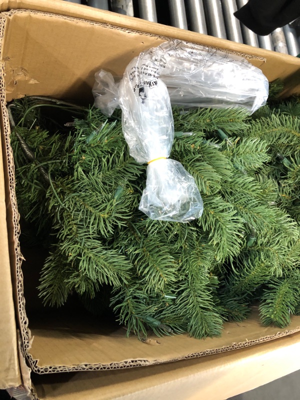 Photo 4 of ***USED***National Tree Company Pre-lit 'Feel Real' Artificial Full Downswept Christmas Tree, Green, Douglas Fir, White Lights, Includes Stand, 7 feet
