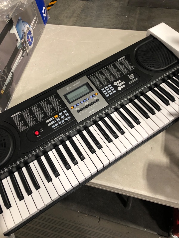 Photo 2 of 61-Key Electronic Keyboard Pack with Headphones,Microphone,Stand,Stool,and Power Supply-The electronic keyboards (Pack of 1) Kit Packing