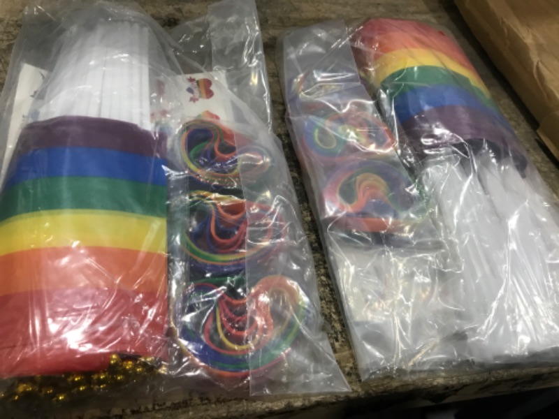 Photo 2 of ADXCO 144 Pieces Gay Pride Accessories Set Include 36 Mini Pride Flags 36 Wristbands, 72 Pieces Pride Temporary Tattoos Rainbow LGBTQ Flag Bracelets Stickers for Gay Pride Month Parade Themed Party              2 packs