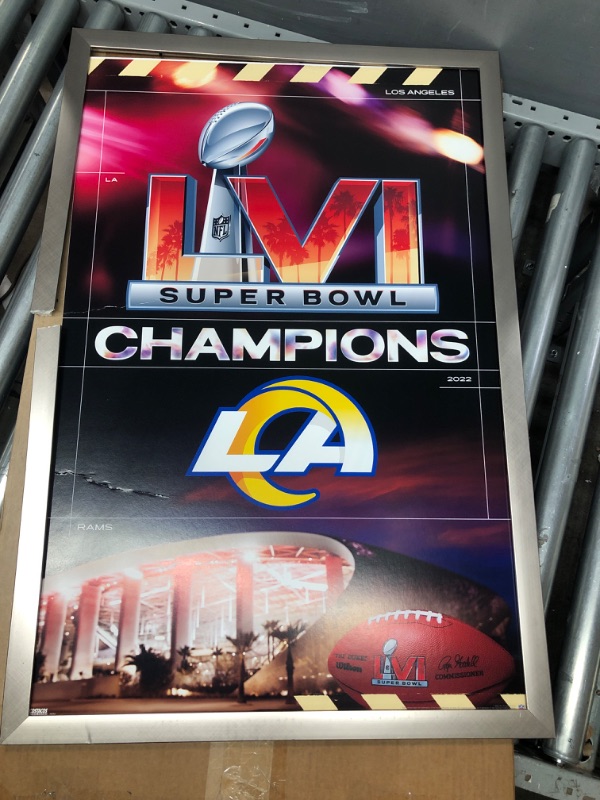 Photo 2 of *MINOR DAMAGE* Trends International NFL Los Angeles Rams - Commemorative Super Bowl LVI Champions Team Logo Wall Poster, 22.375" x 34", Silver Framed Version 22.375" x 34" Silver Framed Version