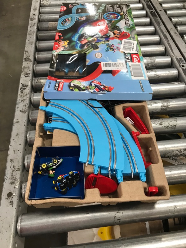 Photo 2 of Carrera First Nintendo Mario Kart Slot Car Race Track - Includes 2 Cars: Mario and Luigi and Two-Controllers - Battery-Powered Beginner Set for Kids Ages 3 Years and Up, 20063028 Mario Kart / Flippers