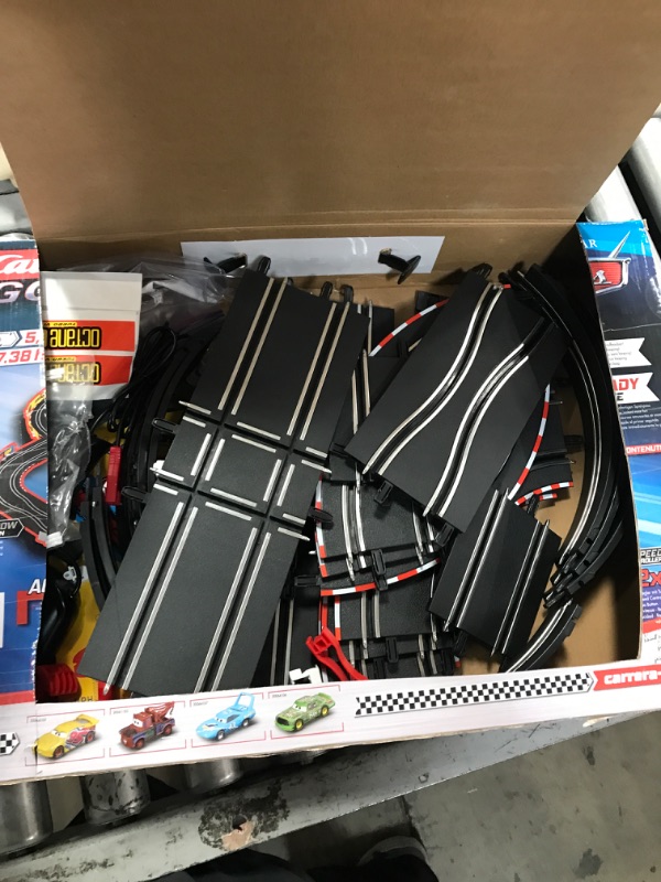 Photo 2 of Carrera GO!!! 62477 Disney Pixar Cars Neon Nights Electric Slot Car Racing Kids Toy Race Track Set Includes 2 Controllers and 2 Cars in 1:43 Scale Disney Cars Neon