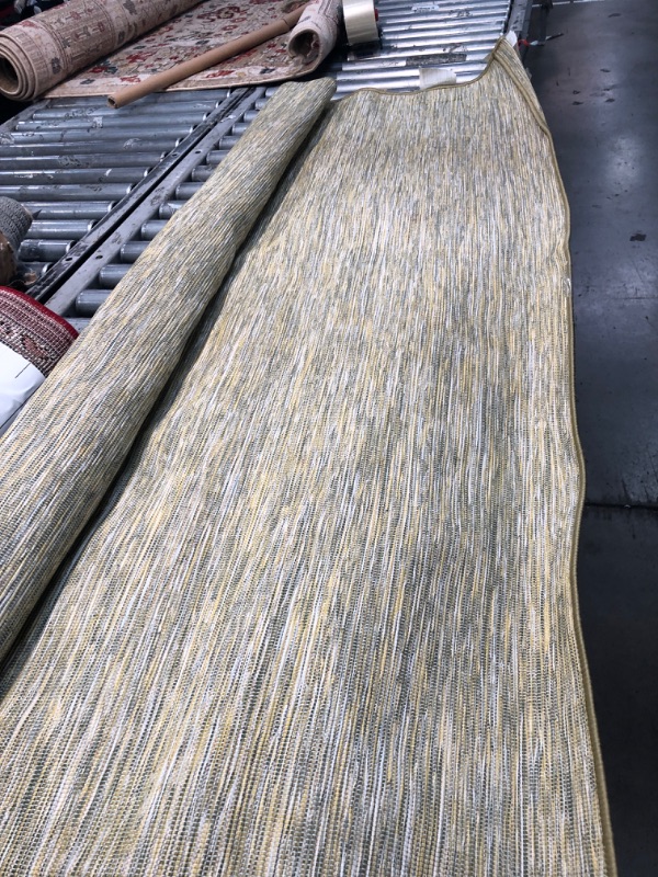 Photo 1 of 5' x 7' stripped green area rug 