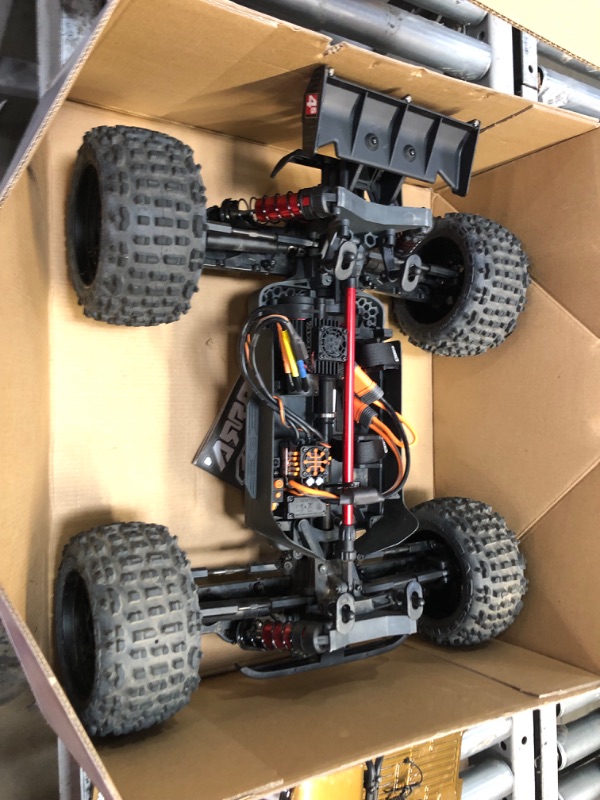 Photo 3 of ARRMA RC Truck 1/10 Outcast 4X4 4S V2 BLX Stunt Truck RTR (Battery and Charger Not Included), Bronze, ARA4410V2T1
