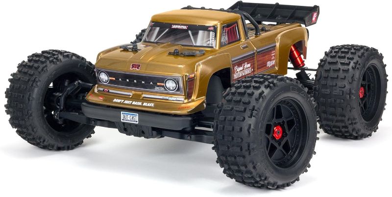 Photo 1 of ARRMA RC Truck 1/10 Outcast 4X4 4S V2 BLX Stunt Truck RTR (Battery and Charger Not Included), Bronze, ARA4410V2T1
