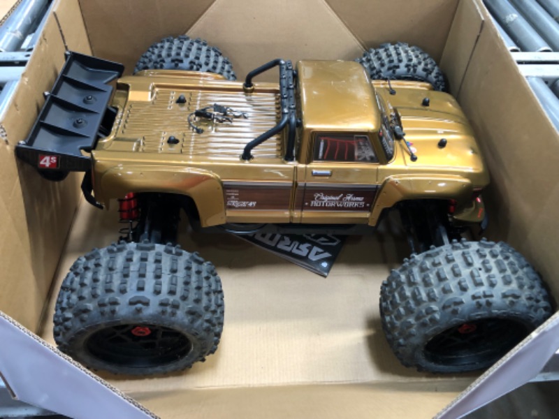 Photo 2 of ARRMA RC Truck 1/10 Outcast 4X4 4S V2 BLX Stunt Truck RTR (Battery and Charger Not Included), Bronze, ARA4410V2T1
