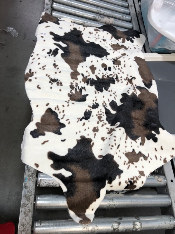 Photo 1 of 42"X29" FAUX COW SKIN RUG 