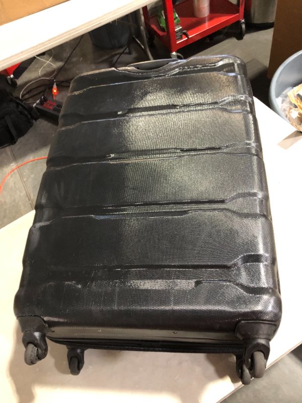 Photo 4 of ***SCUFFED AND SCRAPED - DAMAGED WHEEL - SEE PICTURES***
Samsonite Omni PC Hardside Expandable Luggage with Spinner Wheels, Checked-Large 28-Inch, Black