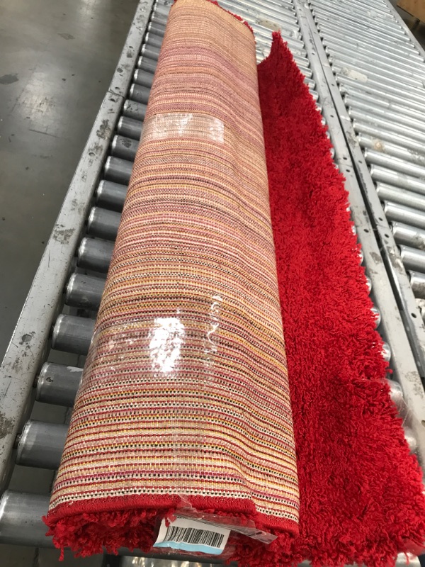 Photo 1 of 4' x 6' red shag rug 