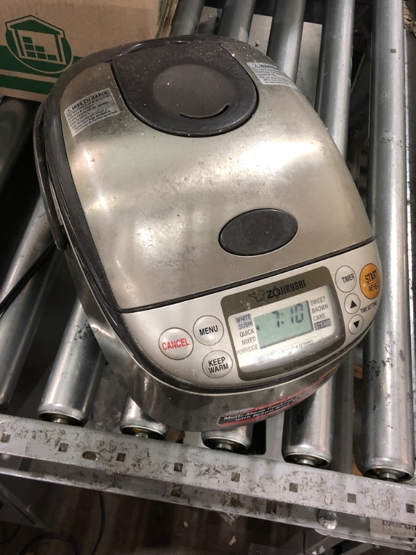 Photo 1 of * item powers on * item used * dirty *
Zojirushi NS-TSC10 5-1/2-Cup (Uncooked) Micom Rice Cooker and Warmer, 1.0-Liter 5.5 cups Rice Cooker