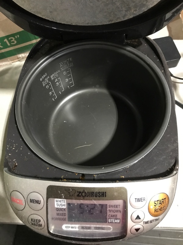 Photo 4 of * item powers on * item used * dirty *
Zojirushi NS-TSC10 5-1/2-Cup (Uncooked) Micom Rice Cooker and Warmer, 1.0-Liter 5.5 cups Rice Cooker