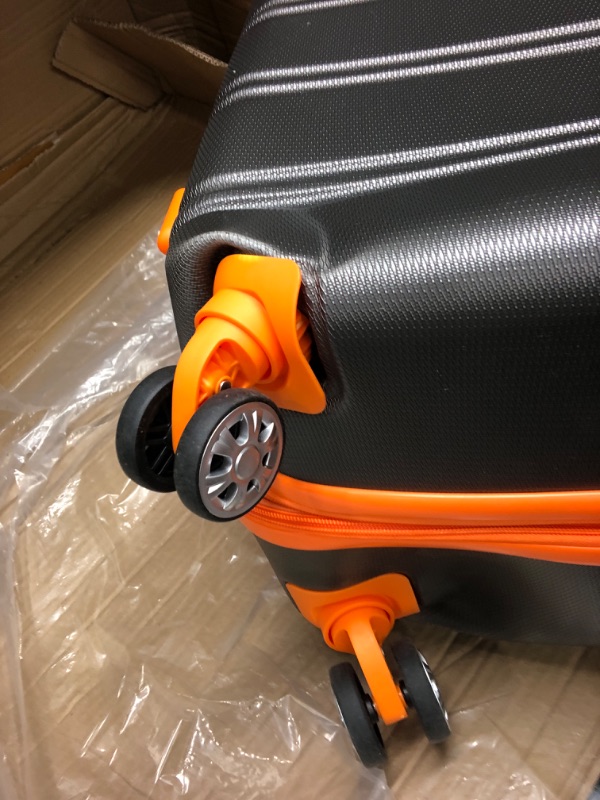 Photo 3 of **2 WHEELS ARE DENTED INWARD BUT FUCNTIONAL**
Rockland Melbourne Hardside Expandable Spinner Wheel Luggage, Charcoal, 2-Piece Set (20/28) 2-Piece Set (20/28) Charcoal
