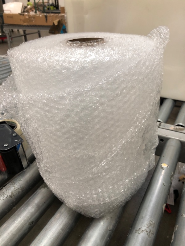 Photo 2 of Amazon Basics Perforated Bubble Cushioning Wrap, Small 3/16", 12-Inch x 175 Foot Long Roll, Clear
