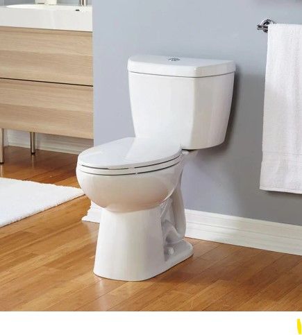 Photo 1 of 2-Piece 0.8 GPF Ultra-High-Efficiency Single Flush Elongated Toilet in White
