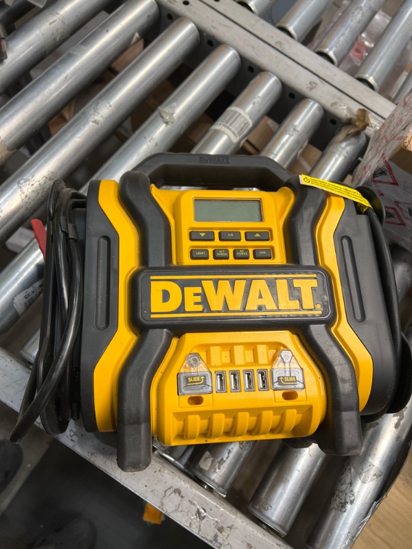 Photo 2 of DEWALT DXAEPS14 1600 Peak Battery Amp 12V Automotive Jump Starter/Power Station with 500 Watt AC Power Inverter, 120 PSI Digital Compressor, and USB Power , Yellow