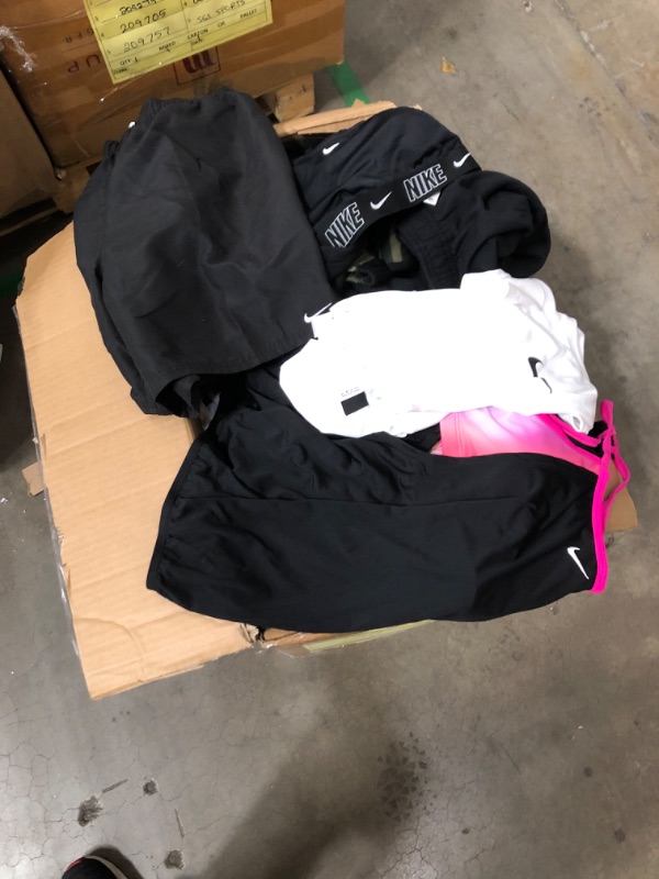 Photo 2 of large box of womens and mens assorted workout clothing all sizes