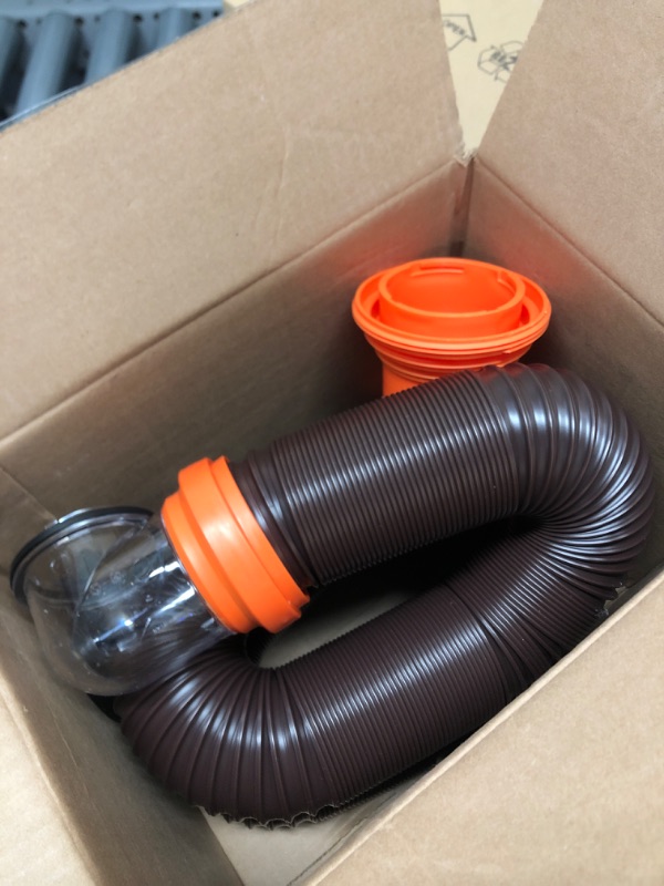 Photo 2 of Camco RhinoFLEX RV Sewer Hose Kit with Swivel Transparent Elbow and 4-in-1 Dump Station Fitting, Brown, 15 Feet (39770) 15ft Sewer Hose Kit Frustration-Free Packaging