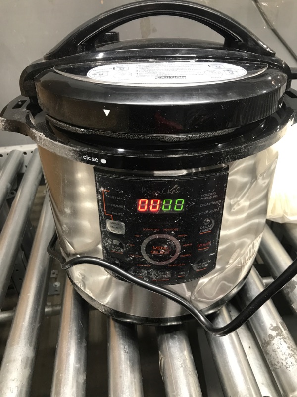 Photo 3 of *****DAMAGED LID, AND HAS DENTS************
MegaChef 12 Quart Digital Pressure Cooker with 15 Preset Options and Glass Lid, Silver
