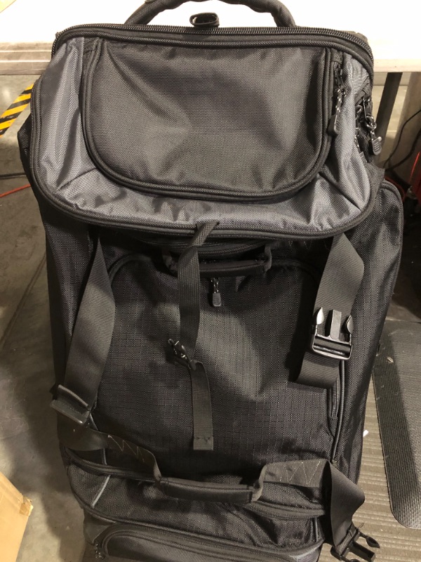 Photo 2 of * used * see images for damage * 
Amazon Basics Ripstop Wheeled Duffel, 30" Black 30" Duffel