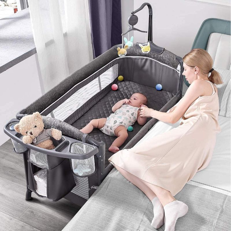 Photo 1 of *********unknown iof completye************
Baby Bassinet Bedside Crib, Pack and Play with Mattress, Diaper Changer and Playards from Newborn to Toddles